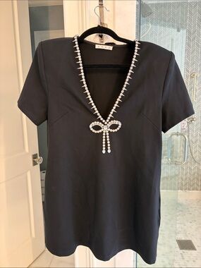 Area Black V-Neck Dress with Crystal Bow Detail and pockets. Size XS